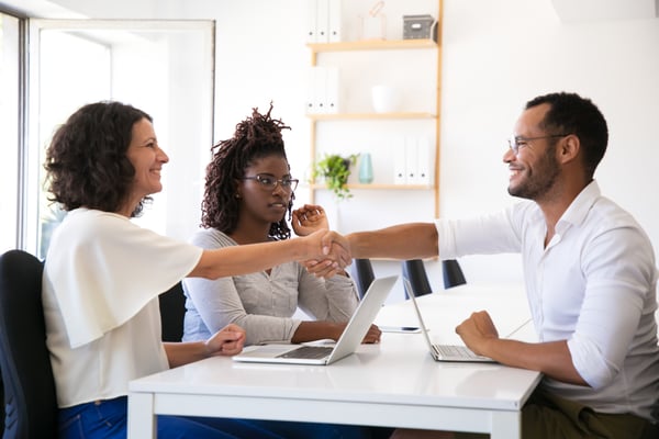 cheerful-business-partners-shaking-hands